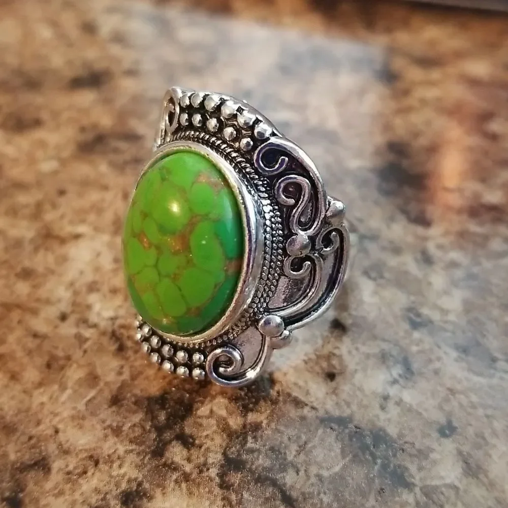 Inlaid turquoise egg shape carved ring size 8